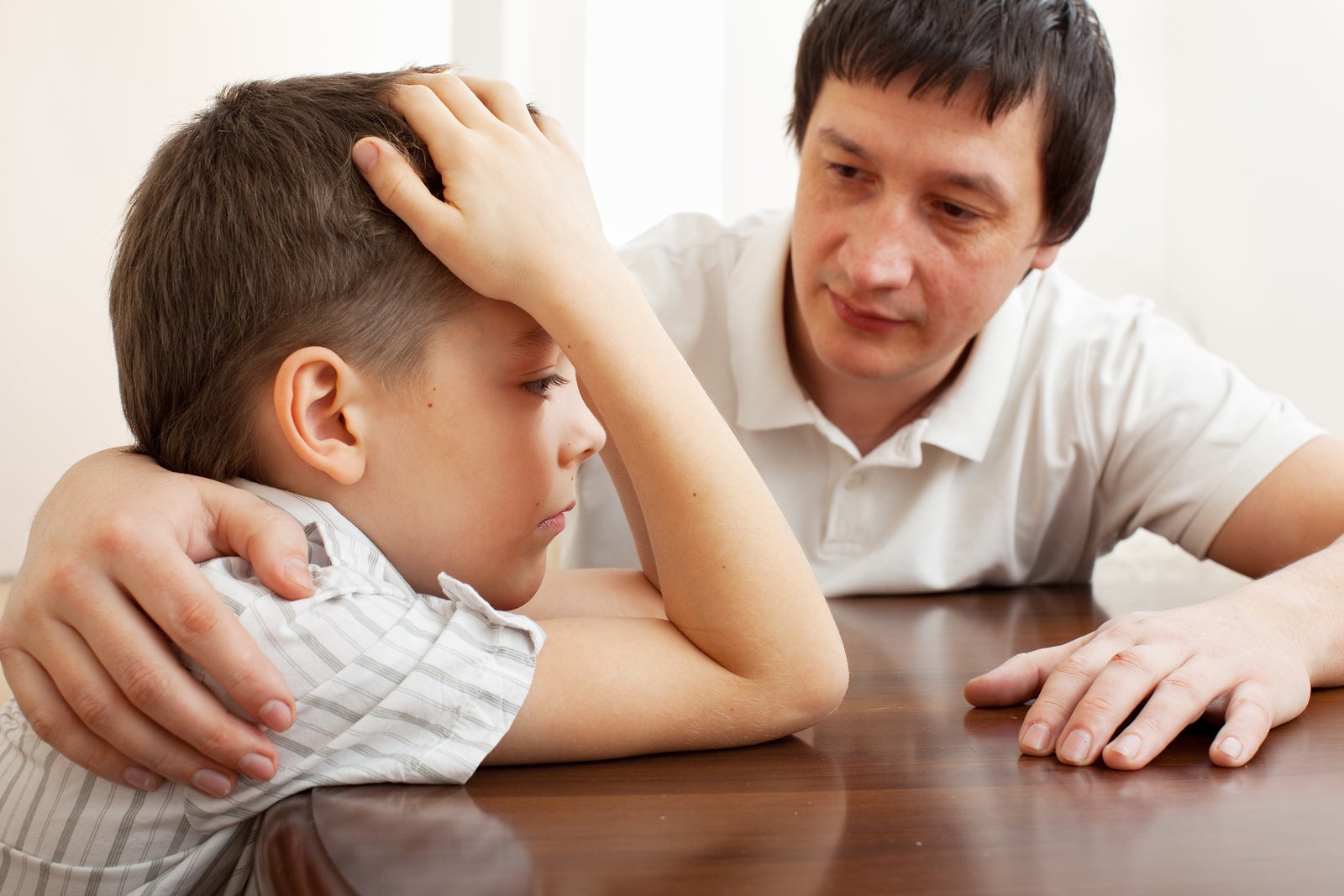 Father Comforts Sad Child