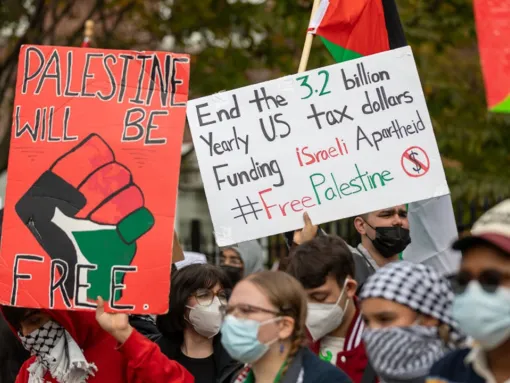 Students from Brooklyn College and supporters hold signs during a pro-Palestinian protest at the entrance of the New York campus on October 12, 2023